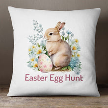 Load image into Gallery viewer, A colorful Easter pillow cover with a playful Easter Bunny surrounded by flowers and an Easter egg with the words &quot;Easter Egg Hunt&quot; printed below it. The design is printed on both sides of the pillow cover.
