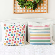 Load image into Gallery viewer, Two Easter pillow covers on a bed. One featuring a pattern of colorful Easter eggs. The other featuring some colorful stripes. The covers are made from high-quality, durable fabric and features a convenient zipper closure.
